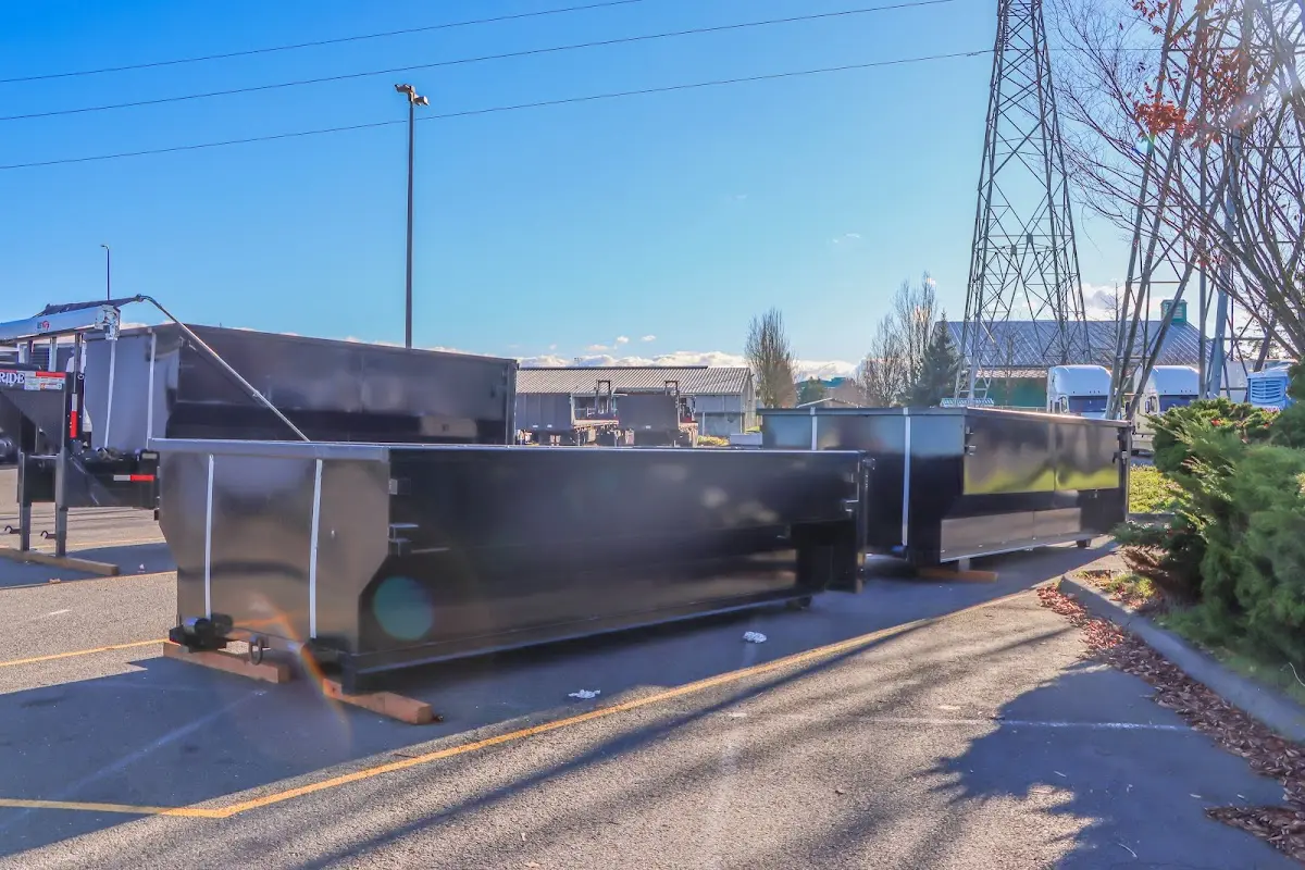 Roll-off dumpster ready for waste disposal at job site for Demolition Dumpster Rental in Roseburg